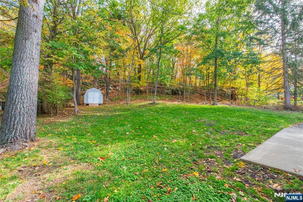 5 Mountain Avenue, Unit 2 Wanaque, NJ 07465 - Photo 19 of 20 a view of a backyard with large trees