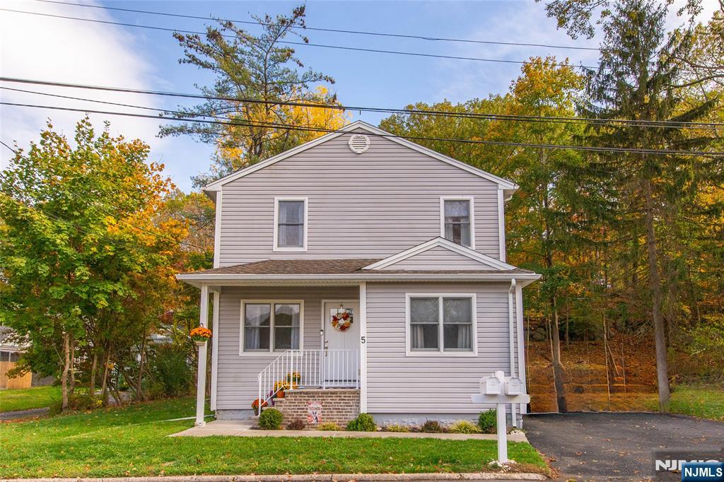 5 Mountain Avenue, Unit 2 Wanaque, NJ 07465 - Photo 20 of 20 a front view of a house with garden