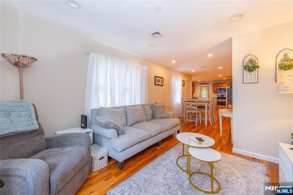 5 Mountain Avenue, Unit 2 Wanaque, NJ 07465 - Photo 8 of 20 a living room with furniture and a rug
