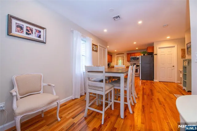 a dining room with furniture and a view of kitchen