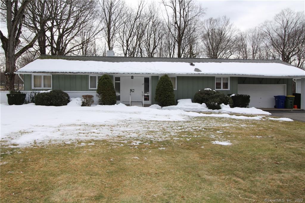 99 Maybrook Road Waterbury, CT 06708 - Photo 1 of 1 a front view of a house with a yard covered in snow