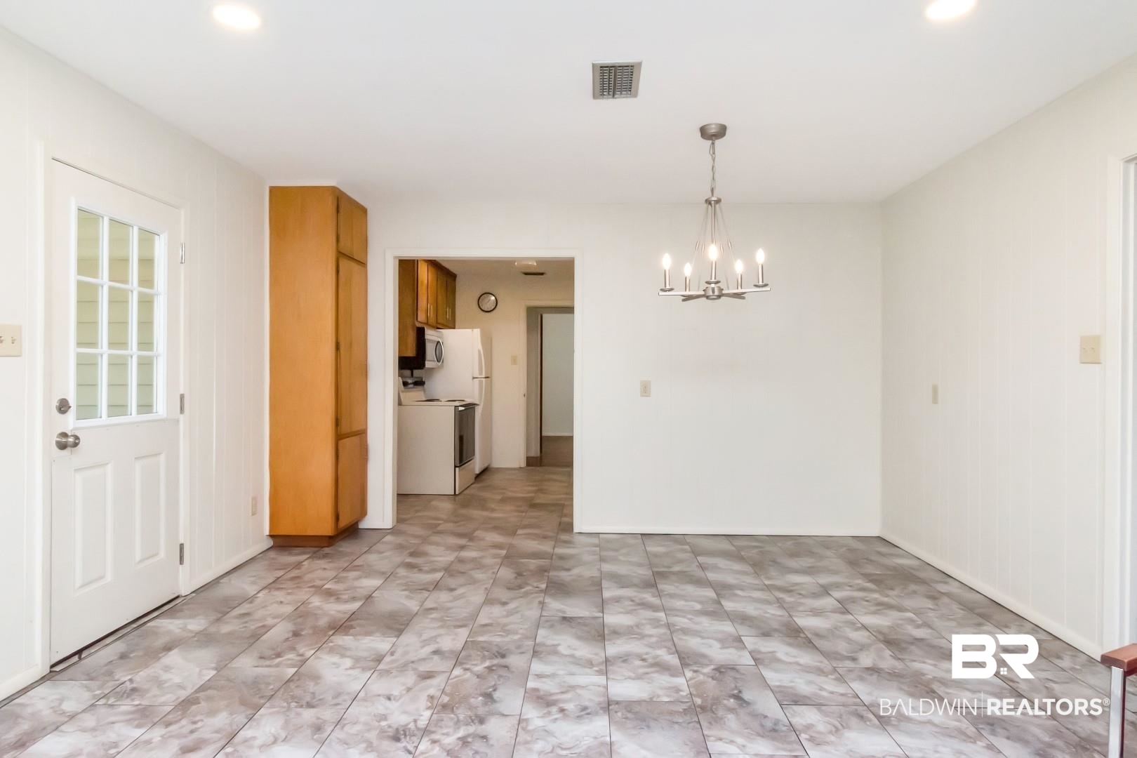 5412 South Norden Drive Mobile, AL 36608 - Photo 20 of 38 Unfurnished dining area with a notable chandelier