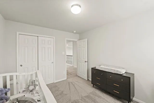 a room with a dresser and a mirror