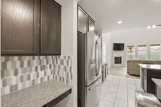 a view of kitchen with furniture and wooden floor