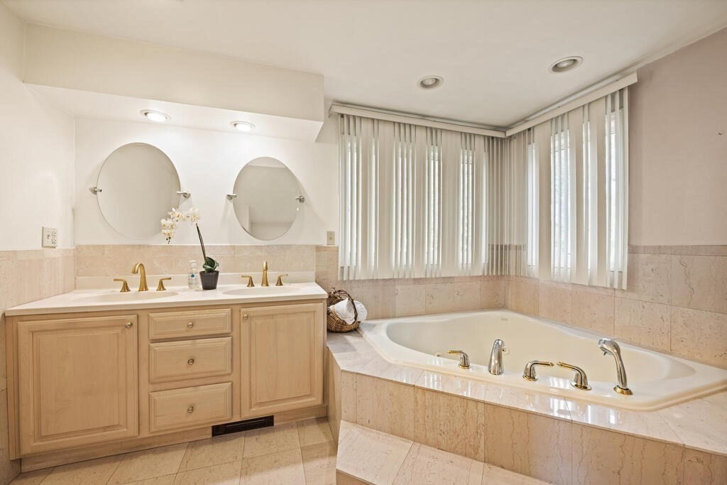 67 Sherburne Road South Lexington, MA 02421 - Photo 15 of 29 a bathroom with a tub sink and mirror