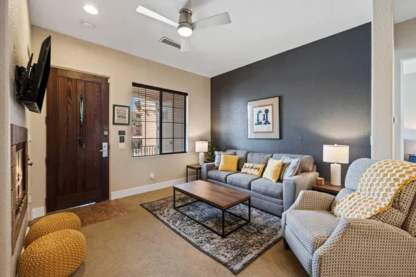 a living room with furniture and a flat screen tv