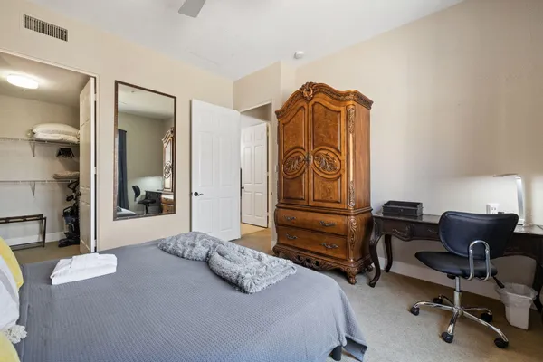 a bedroom with a bed and furniture