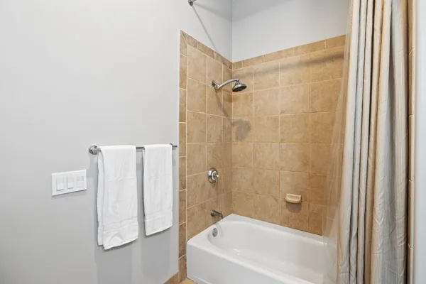 a bathroom with a white bath tub