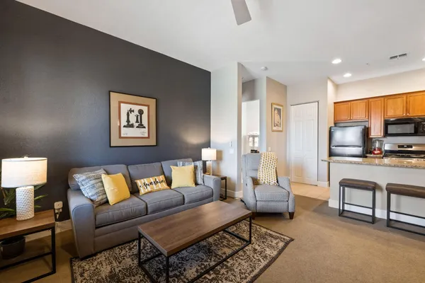 a living room with furniture and a flat screen tv
