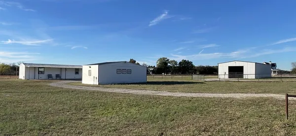 a house view with a backyard space
