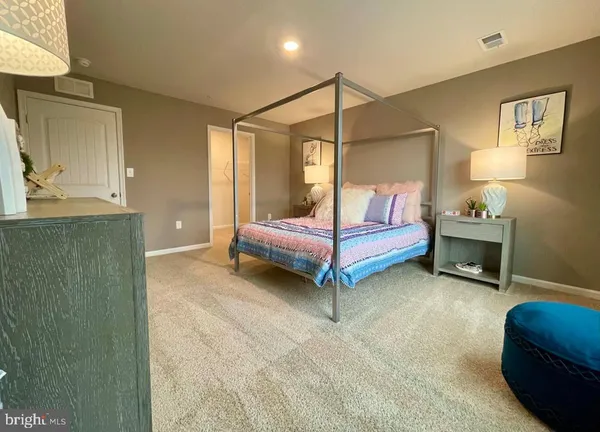 a bedroom with a bed and a cabinets