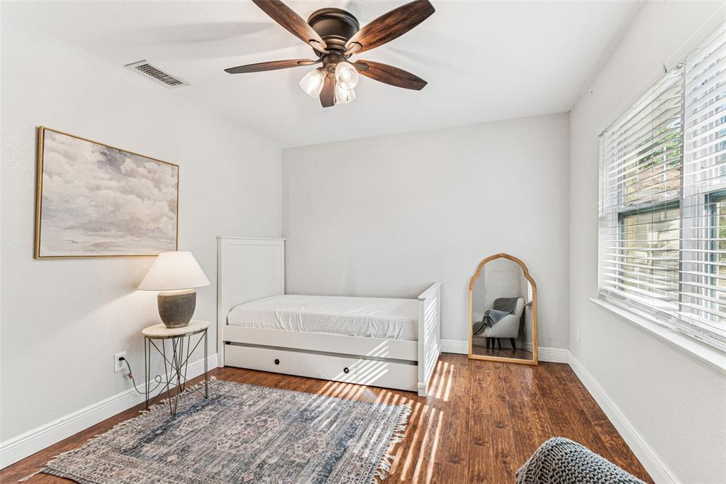 727 Locust Street Tarpon Springs, FL 34689 - Photo 17 of 47 a bedroom with a bed and a large window