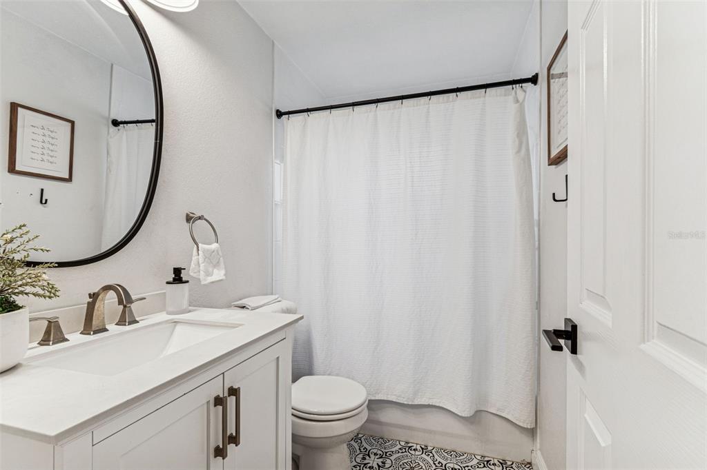 727 Locust Street Tarpon Springs, FL 34689 - Photo 19 of 47 a bathroom with a sink and a mirror