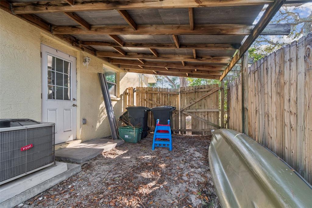 727 Locust Street Tarpon Springs, FL 34689 - Photo 33 of 47 a view of water heater room with wooden floor