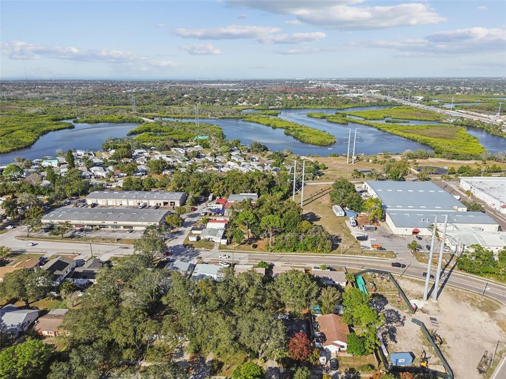 727 Locust Street Tarpon Springs, FL 34689 - Photo 41 of 47 an aerial view of a city with lots of residential buildings ocean and mountain view in back