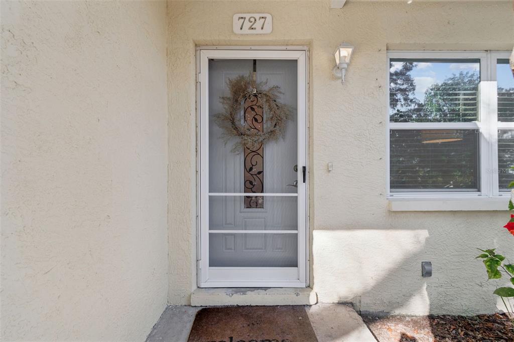 727 Locust Street Tarpon Springs, FL 34689 - Photo 5 of 47 a view of a hallway with wooden floor and a window