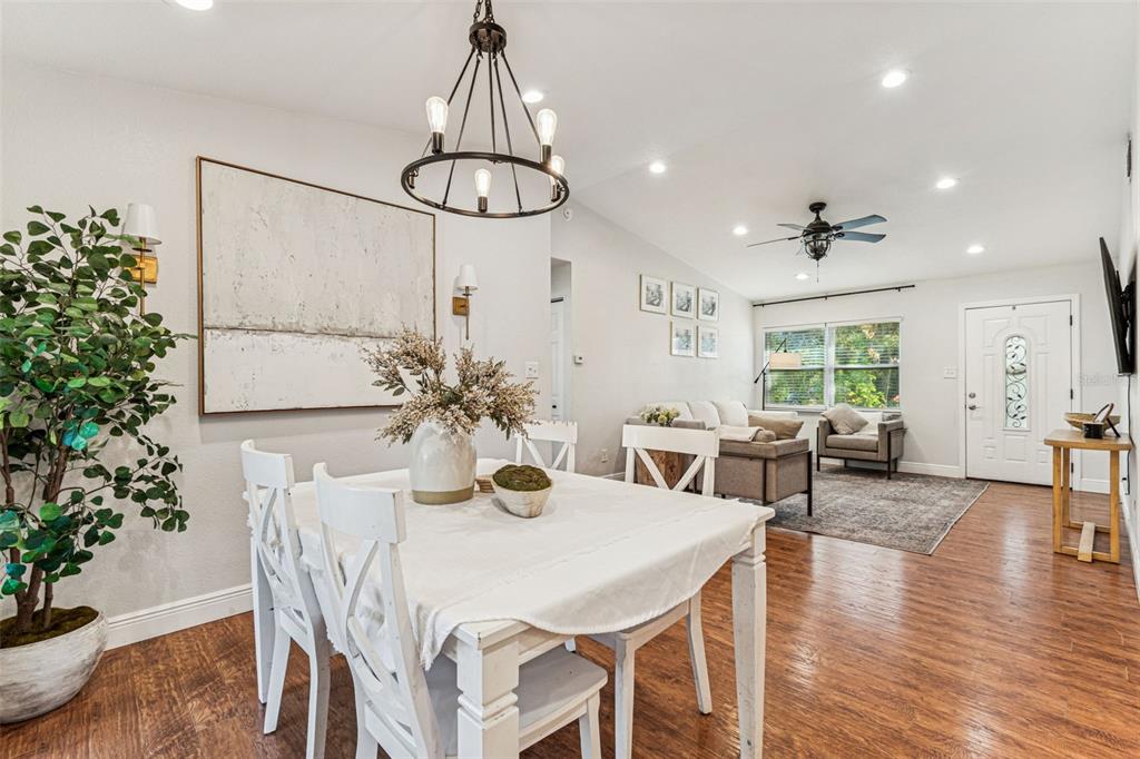 727 Locust Street Tarpon Springs, FL 34689 - Photo 9 of 47 a view of a dining room with furniture window and wooden floor