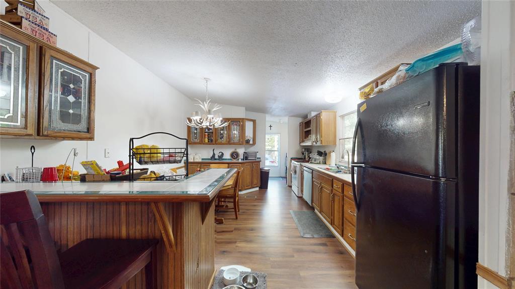 670 Arbin Culpepper Road Jonesboro, LA 71251 - Photo 5 of 17 a kitchen with refrigerator and stove
