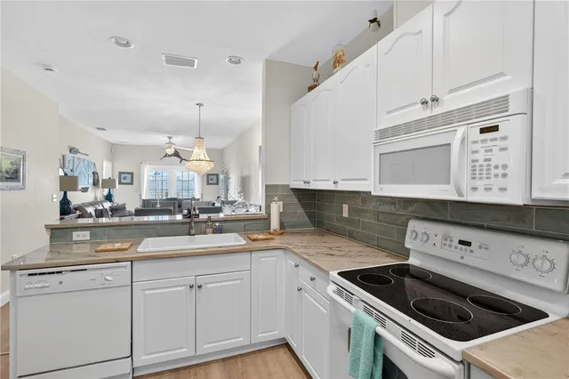 a kitchen with a stove and a microwave