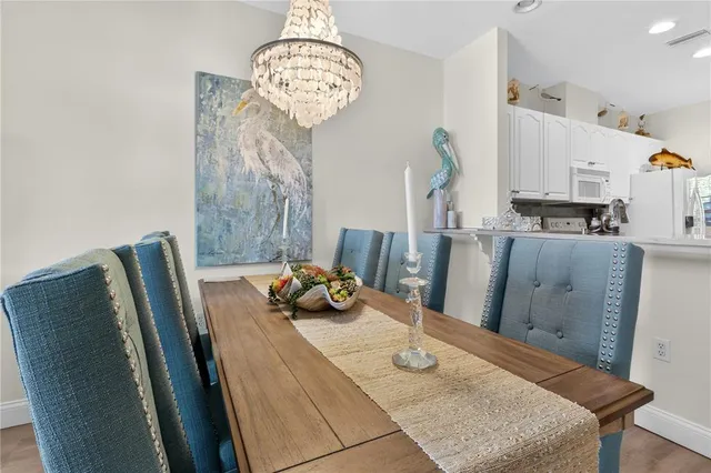 a living room with furniture and a view of bedroom