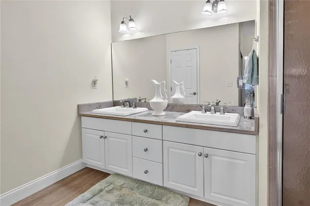 a white toilet sitting next to a bathroom sink