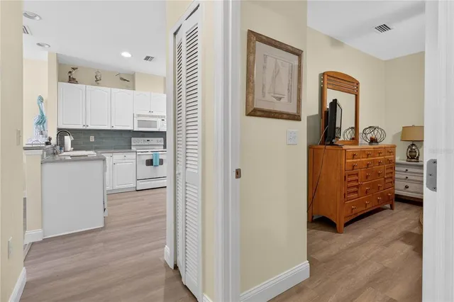 a bathroom with a granite countertop sink a toilet and a shower