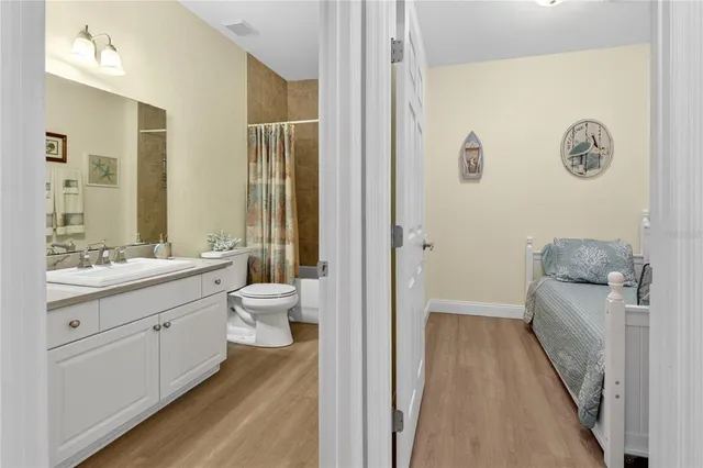 a bedroom with a bed and a couch