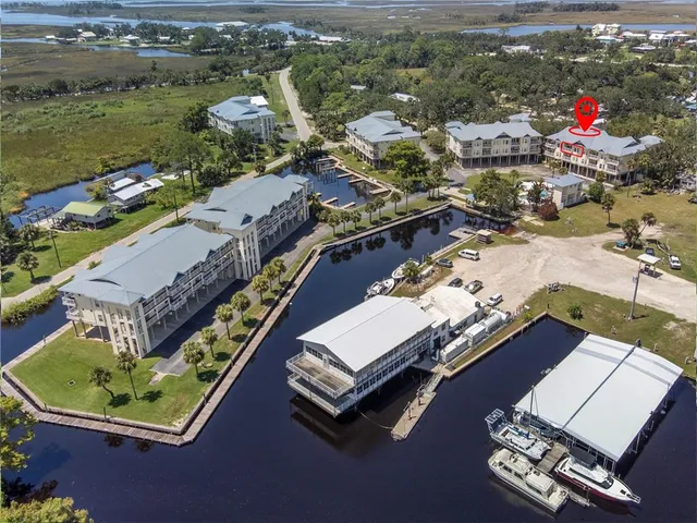 an aerial view of a house with a lake view