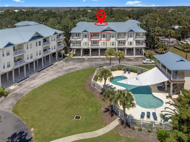 an aerial view of a house with swimming pool