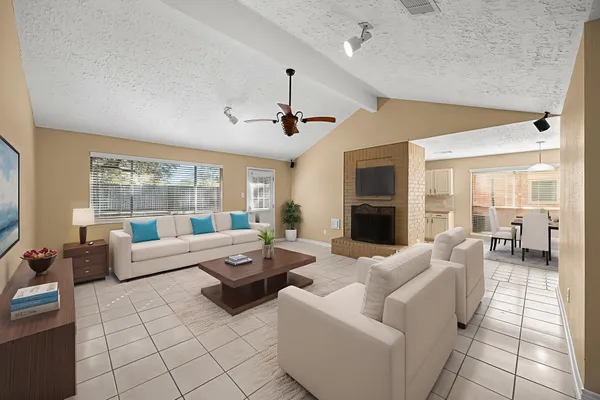 a living room with furniture fireplace and a flat screen tv