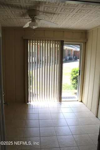 a view of an empty room with a window