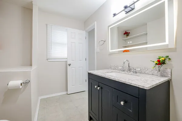 a kitchen with stainless steel appliances granite countertop a refrigerator sink and stove
