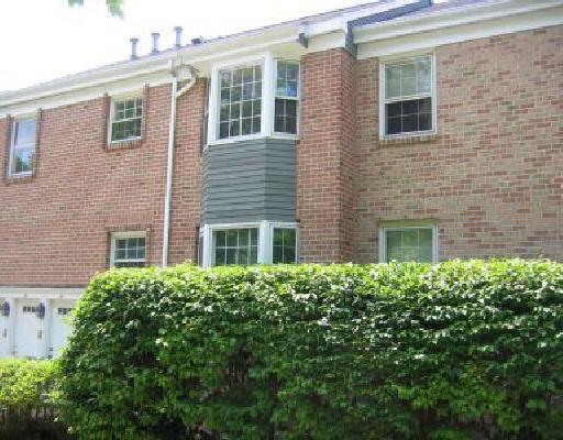 3 Valley View Road, Unit 39 Norwalk, CT 06851 - Photo 1 of 1 a yellow building with potted plants in front of it