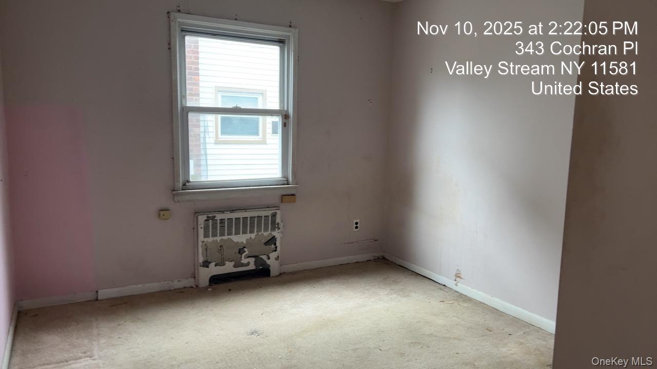 343 Cochran Place Valley Stream, NY 11581 - Photo 14 of 17 an empty room with a window