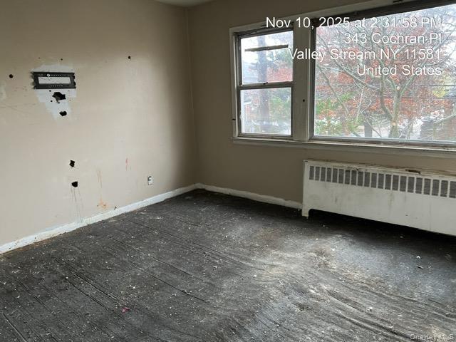 343 Cochran Place Valley Stream, NY 11581 - Photo 15 of 17 an empty room with a window