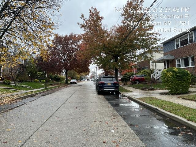 343 Cochran Place Valley Stream, NY 11581 - Photo 17 of 17 a view of street with parked cars