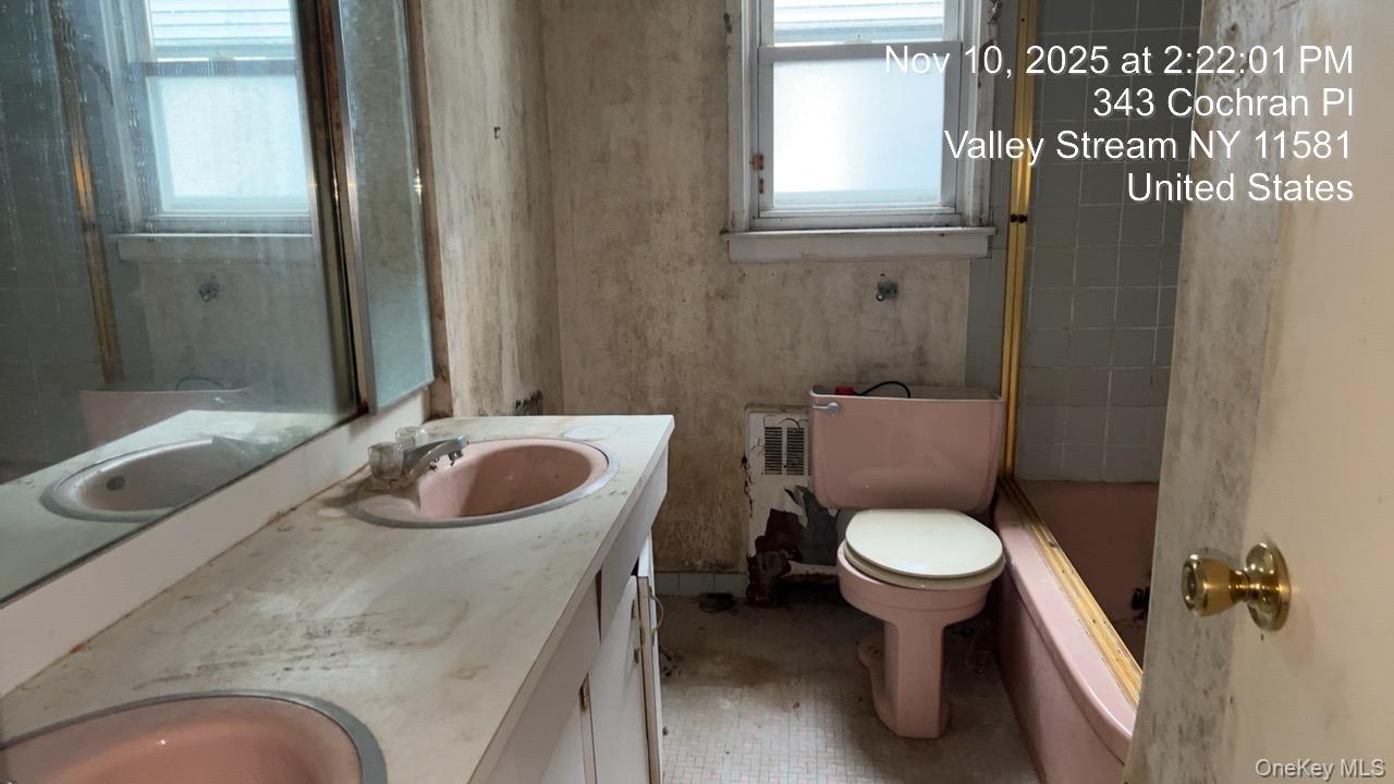 343 Cochran Place Valley Stream, NY 11581 - Photo 8 of 17 a bathroom with a sink and a toilet