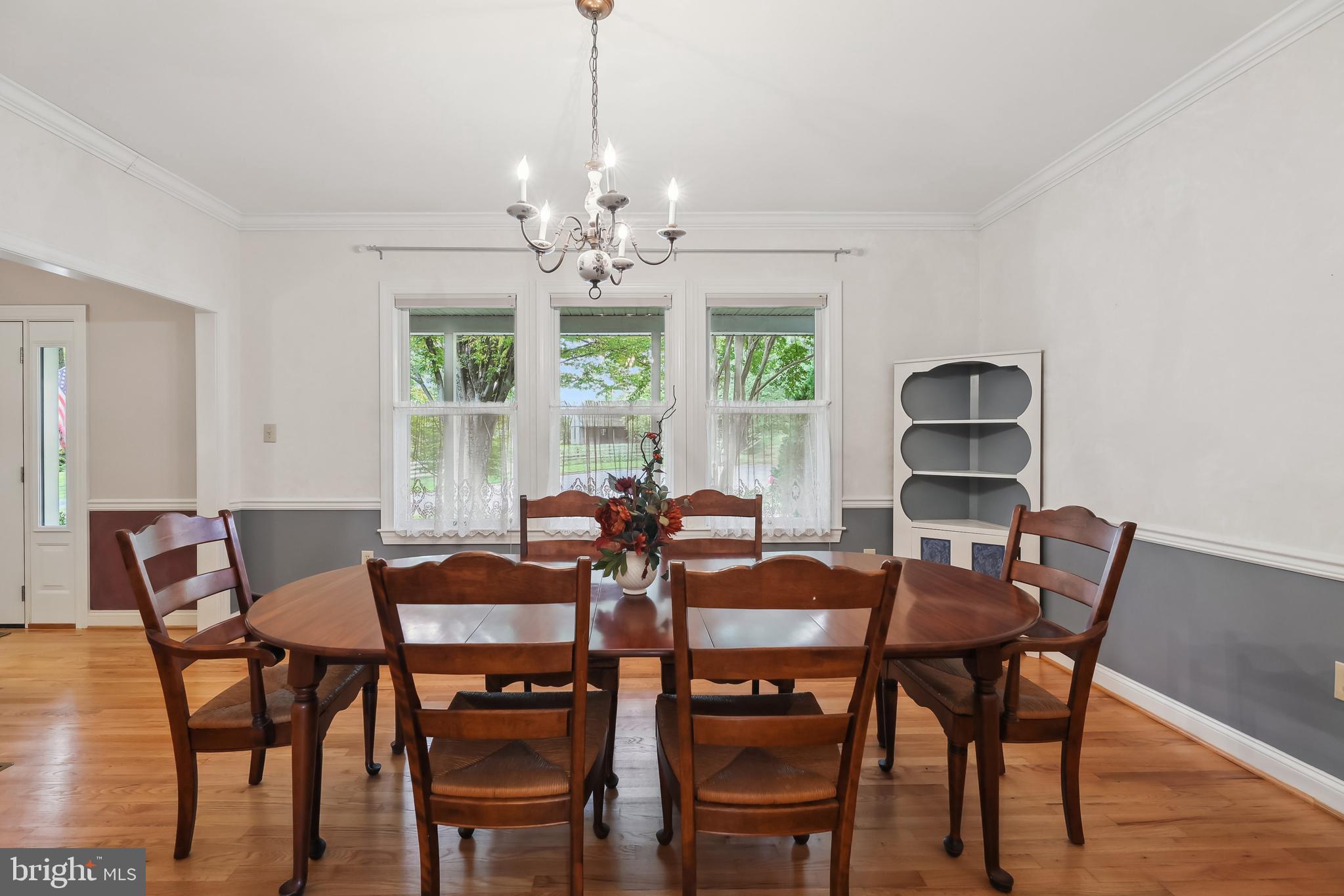 11906 Progress Lane Bowie, MD 20721 - Photo 20 of 107 Chandelier and Hardwood Floors In Dining Room