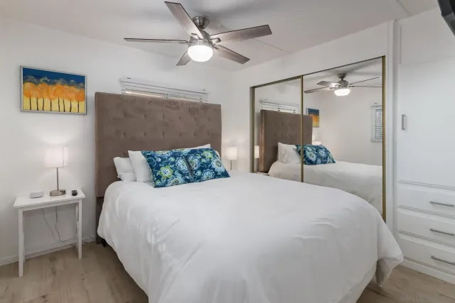 a large white bed in a white room