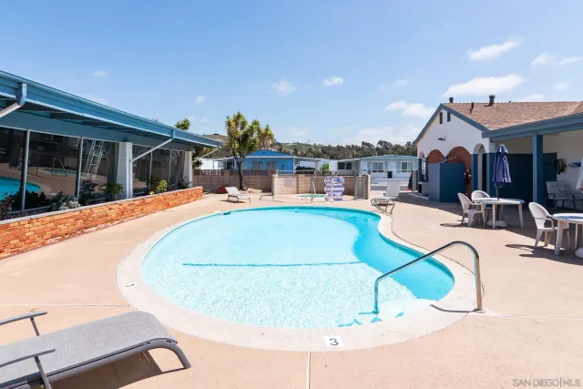 an aerial view of a house with swimming pool