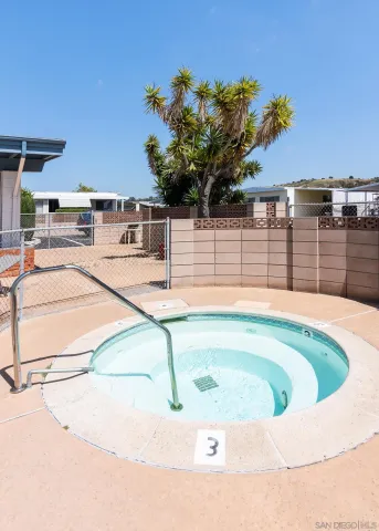 a view of a swimming pool with a patio