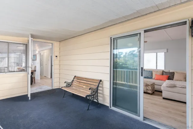 a living room with furniture and a gate