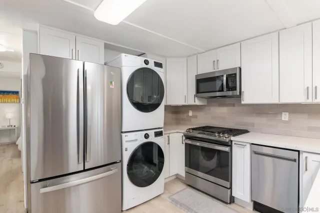 a view of kitchen with washer and dryer