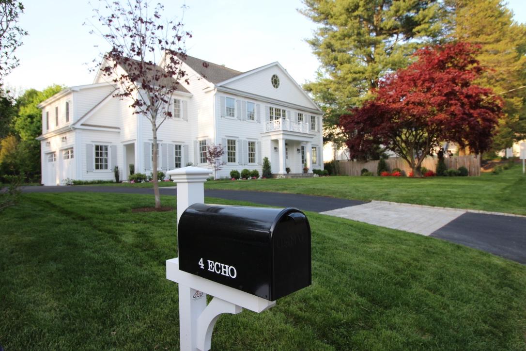 a front view of a house with a yard
