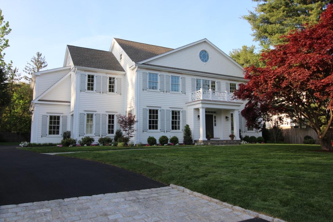4 Echo Drive Darien, CT 06820 - Photo 2 of 40 a front view of a white house with a yard