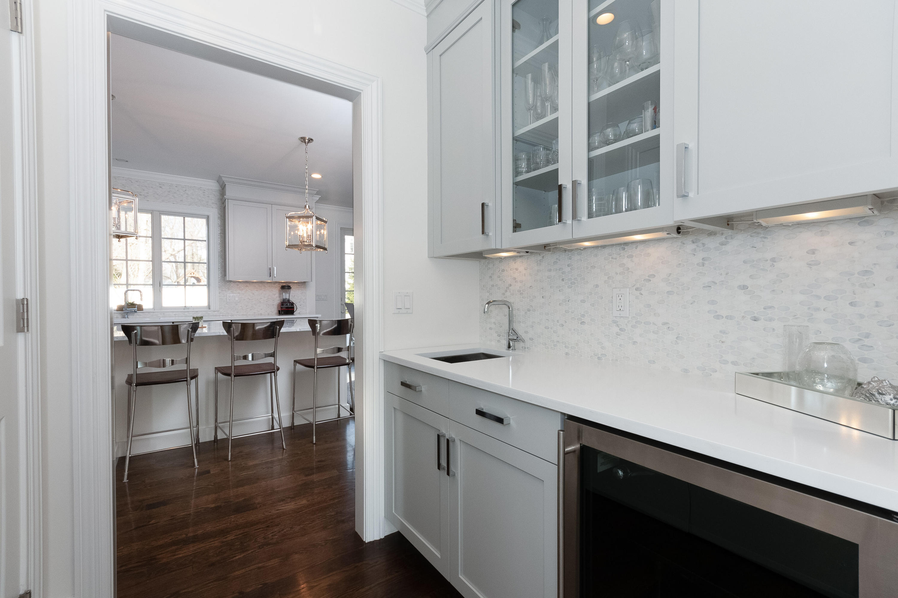 4 Echo Drive Darien, CT 06820 - Photo 12 of 40 a kitchen with a sink cabinets and wooden floor