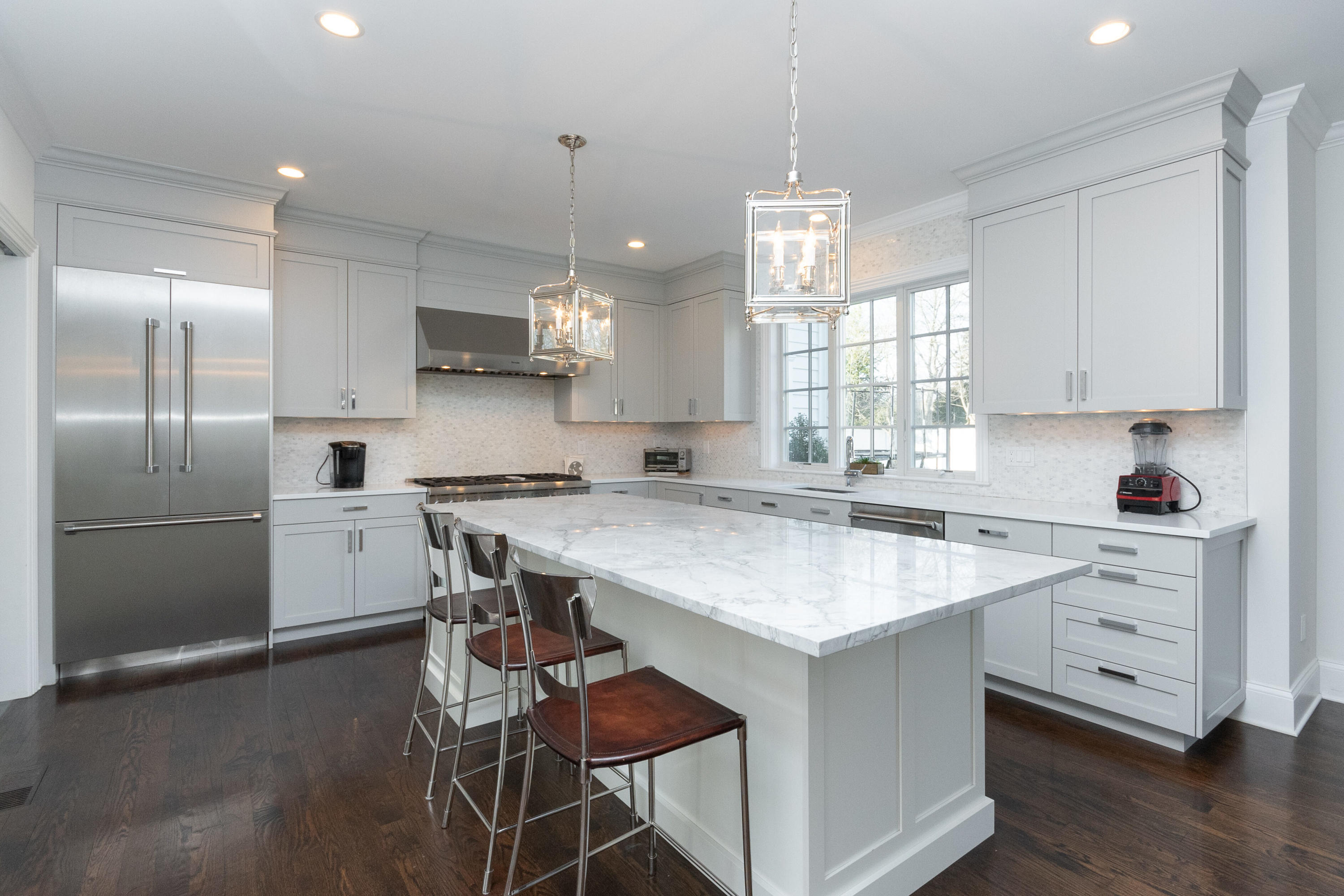 4 Echo Drive Darien, CT 06820 - Photo 15 of 40 a kitchen with a center island appliances and cabinets