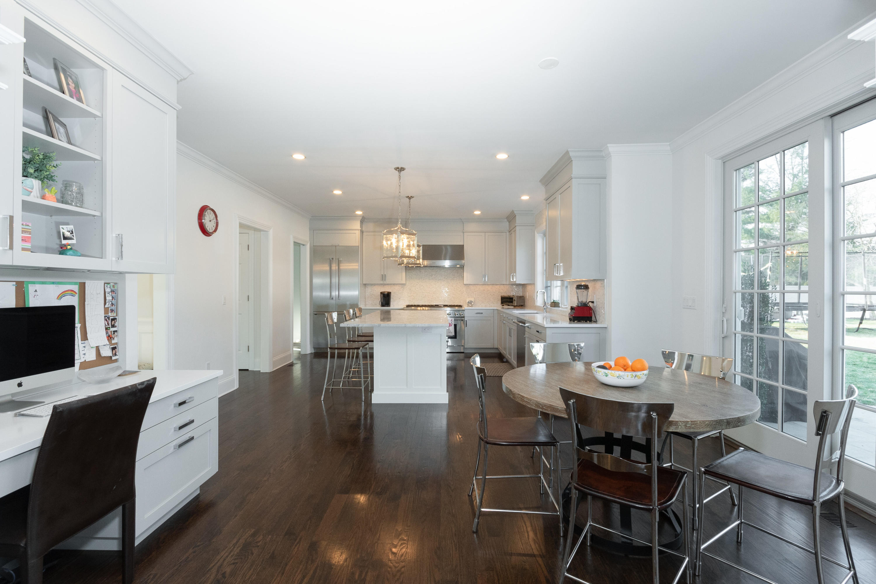 4 Echo Drive Darien, CT 06820 - Photo 16 of 40 a open dining room with stainless steel appliances kitchen island furniture and a fireplace