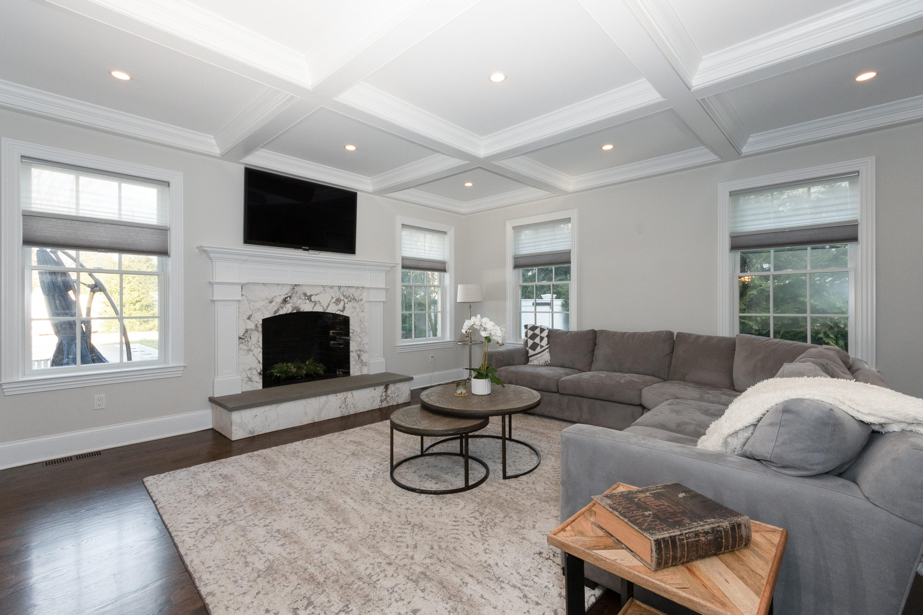 4 Echo Drive Darien, CT 06820 - Photo 18 of 40 a living room with furniture a fireplace and a flat screen tv