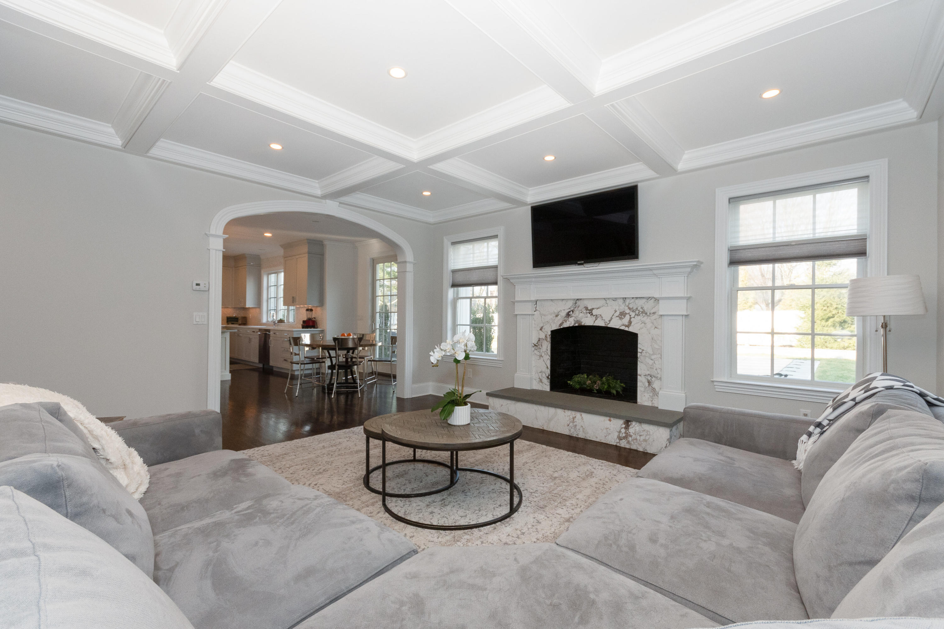4 Echo Drive Darien, CT 06820 - Photo 20 of 40 a living room with furniture a flat screen tv and a fireplace